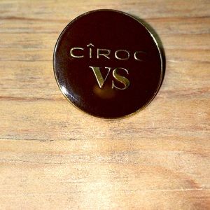 5/$25 New Ciroc VS enamel pin. Brown background and gold writing.